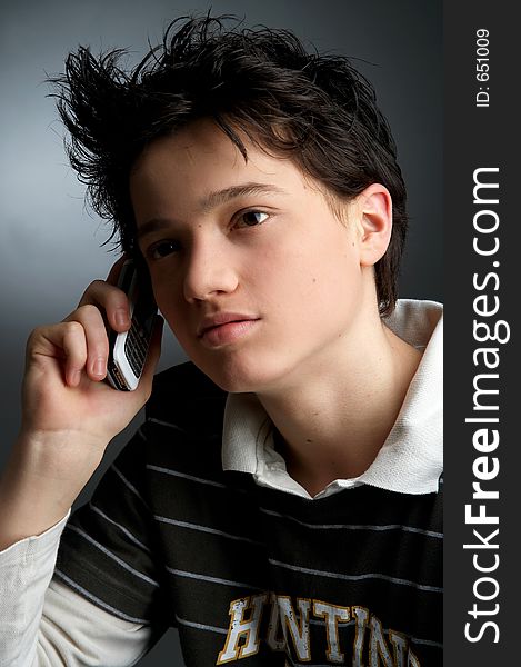 Young man on dark Background with cell phone. Young man on dark Background with cell phone