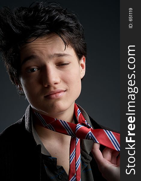 Young man on dark Background with red tie. Young man on dark Background with red tie