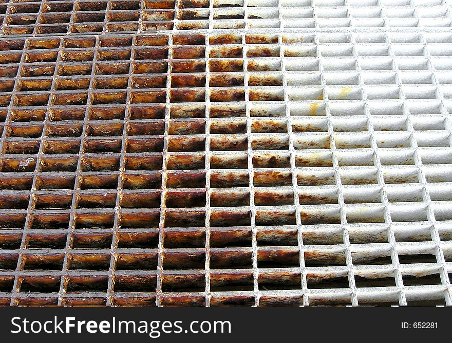 Rusty grid over water on a dock at Catalina Island, California