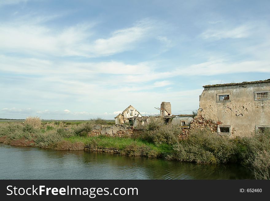 Ruins of old house and river