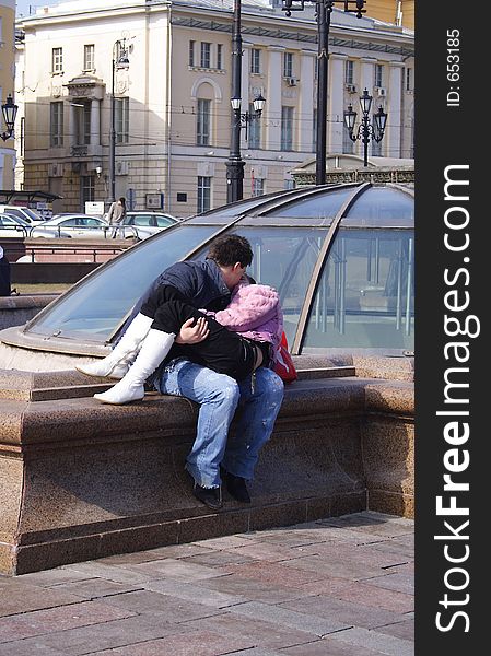 Girl kisses its friend on Manezhnaja Square in Moscow. Girl kisses its friend on Manezhnaja Square in Moscow