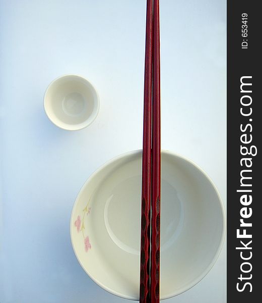 Chinese bowl, chopsticks and cup,in restrictive composition. Chinese bowl, chopsticks and cup,in restrictive composition
