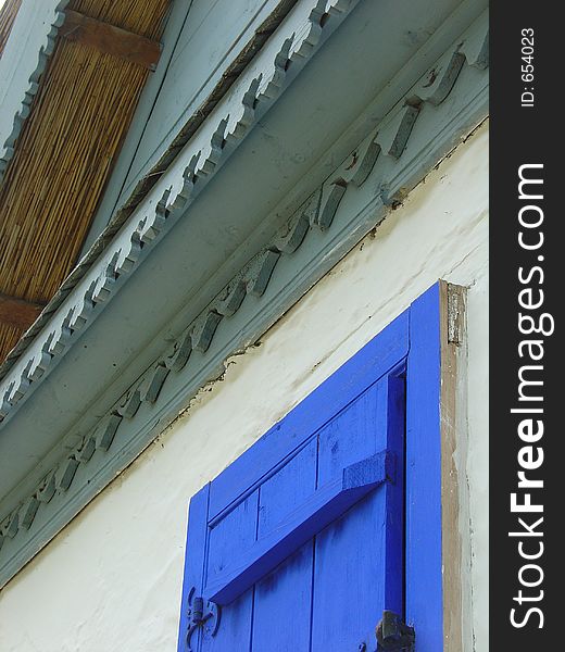 House with blue window