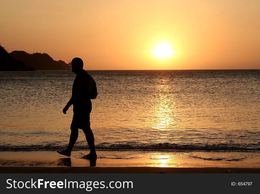 Man watching sunset *** Local Caption *** Man watching sunset. Colombia. Taganga Bay.
