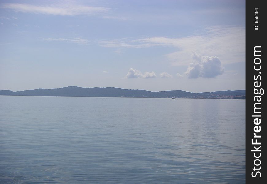 Adriatic sea view from the Croatian coast near Zadar towards the insland of Pasman. Adriatic sea view from the Croatian coast near Zadar towards the insland of Pasman.