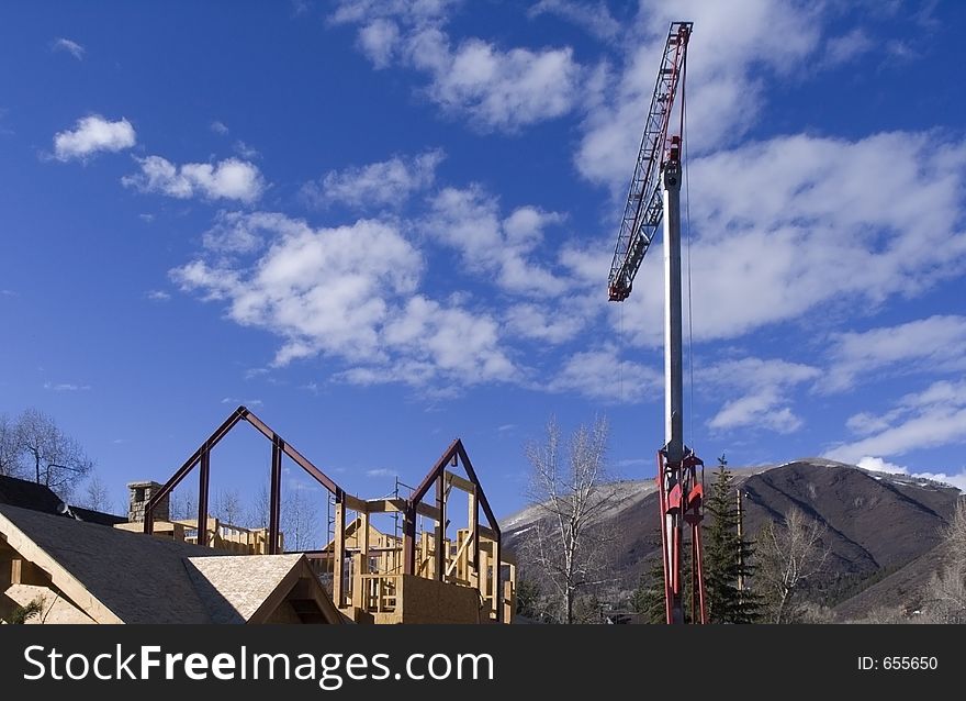 Small construction in the mountains with crane. Small construction in the mountains with crane