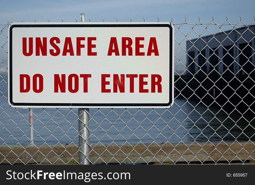 Sign on fence. Sign on fence.