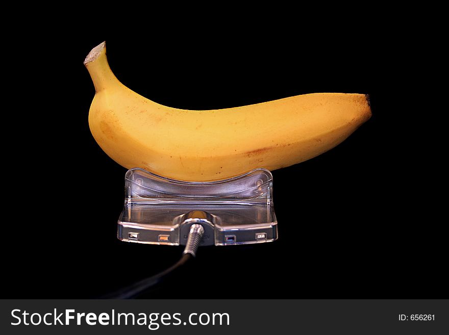 Image of a banana being 'charged' - conceptual energy. Image of a banana being 'charged' - conceptual energy