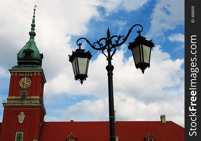 Castle tower with a street lamp in the historical center of Warsaw, Poland. Castle tower with a street lamp in the historical center of Warsaw, Poland