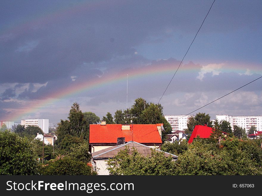 Rainbow after the rain in city