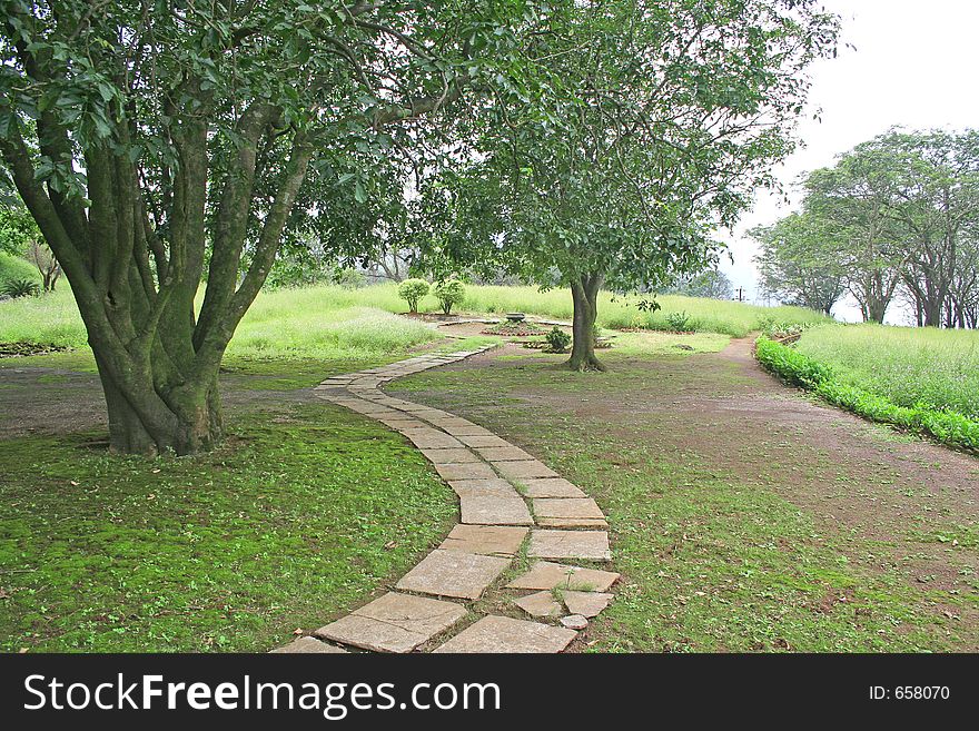 Winding pathway through garden in India. Winding pathway through garden in India