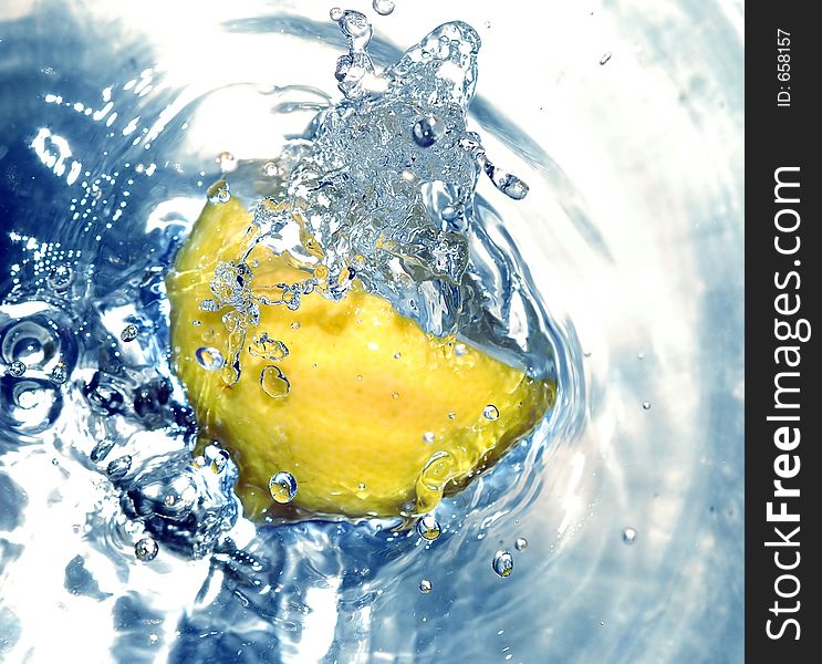 Lemon splashing water. Lemon splashing water