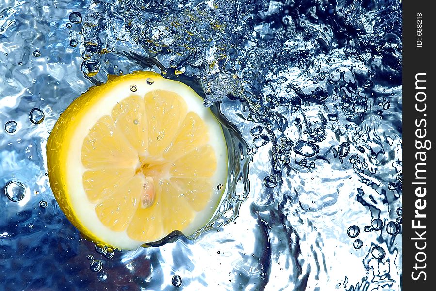 Lemon splashing water