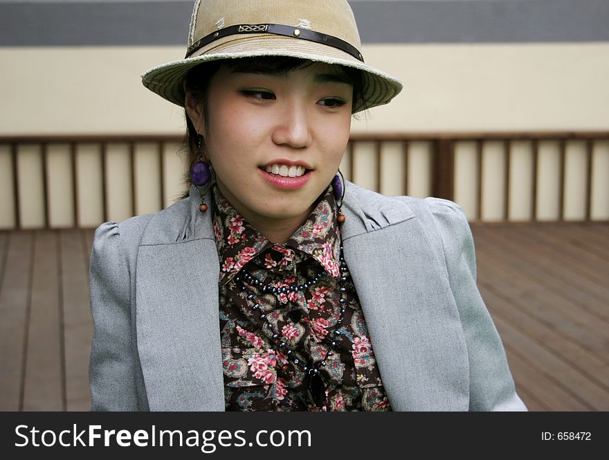 Pretty Korean woman wearing a hat