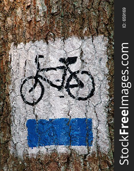 Bike trail sign painted on the tree,europe,poland