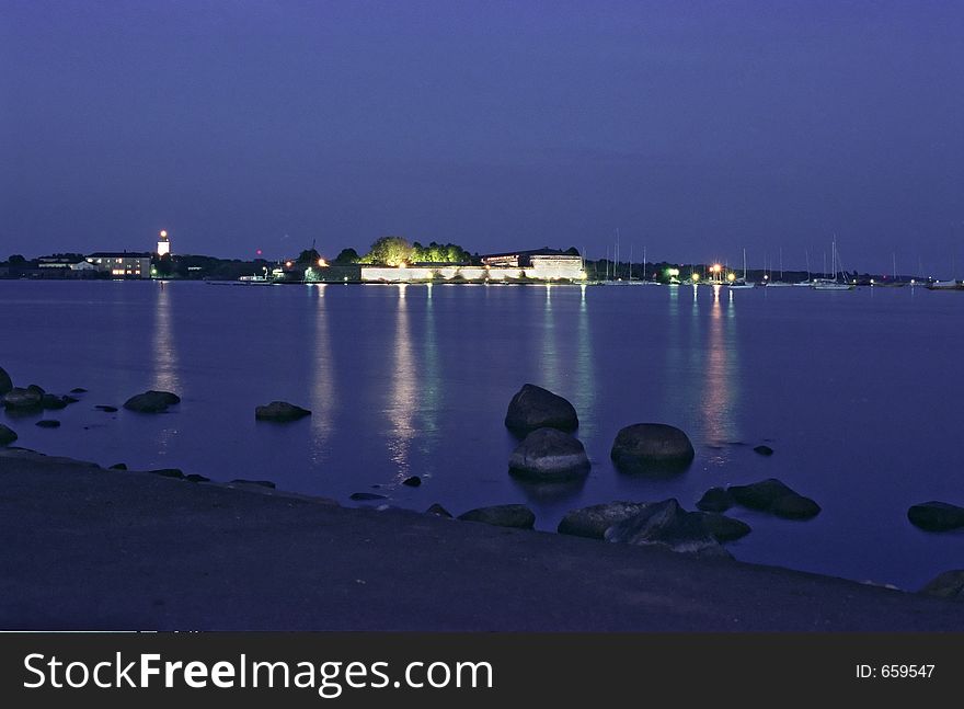 Fortress on island at night light, Finnish Gulf