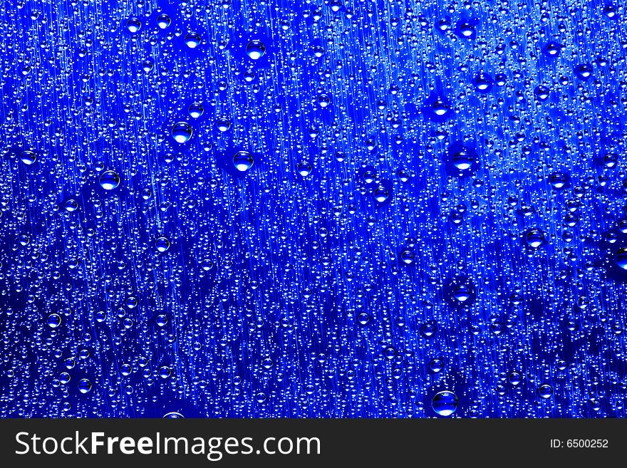 Drops of water on a blue background. Drops of water on a blue background.