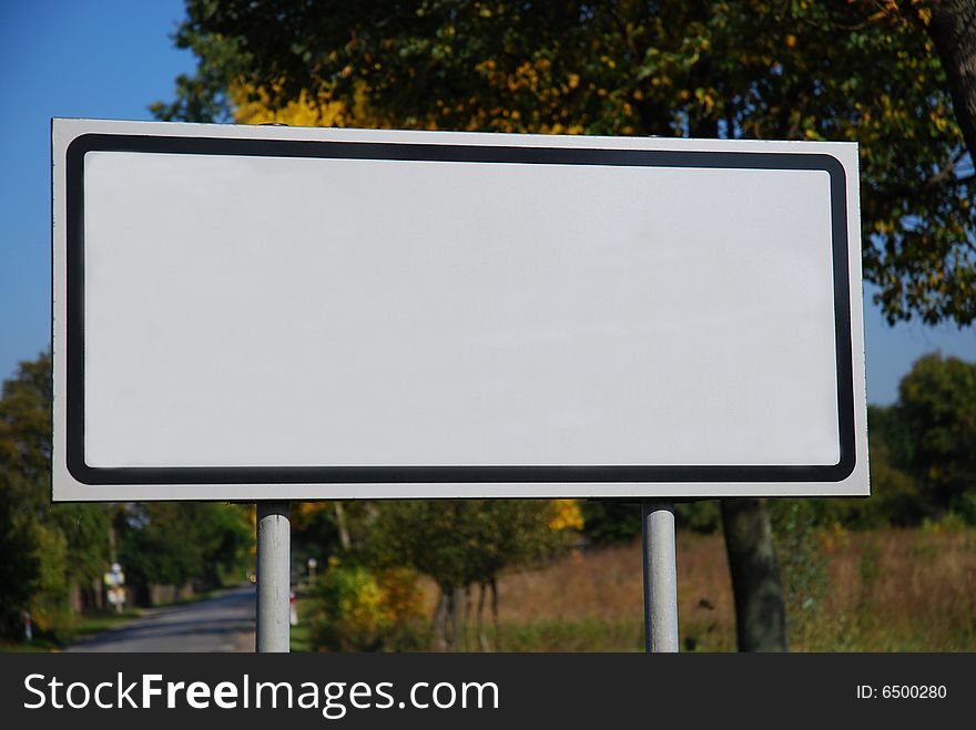 Empty billboard on the trees