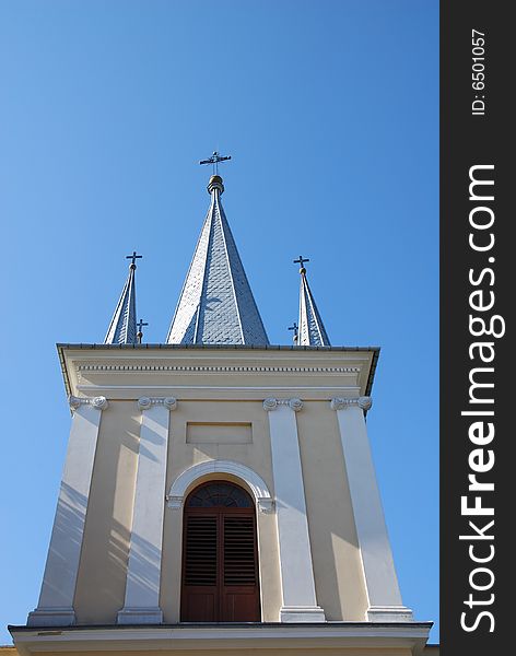 Church tower on the blue sky
