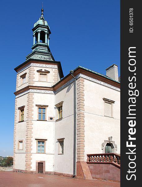 Castle tower on the blue sky