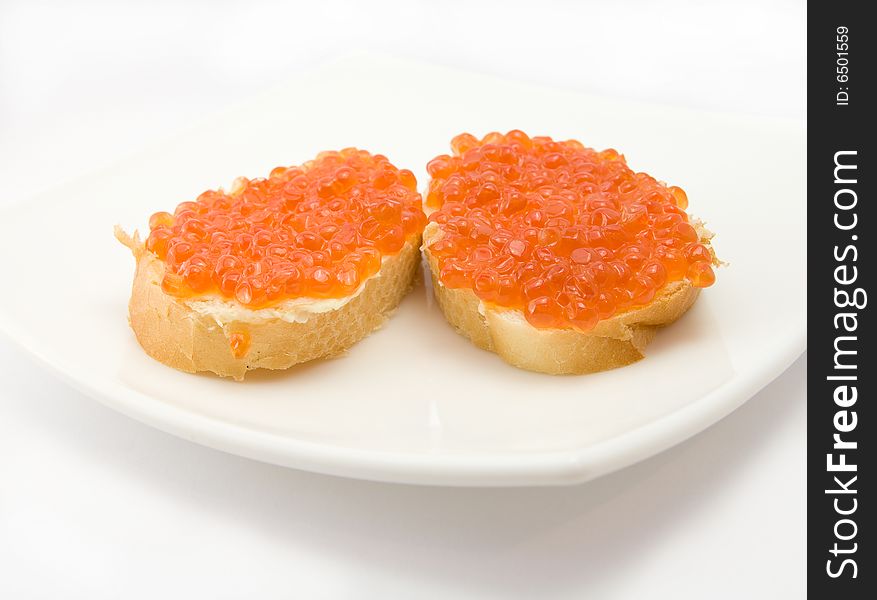 Sandwiches with caviar on plate