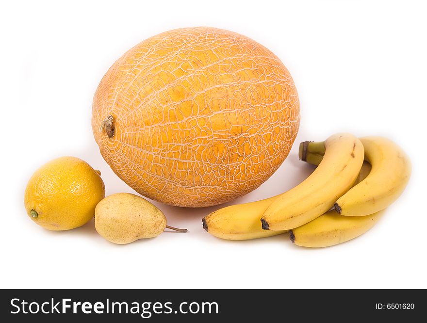 Yellow pear melon bananas and lemon on white background. Yellow pear melon bananas and lemon on white background