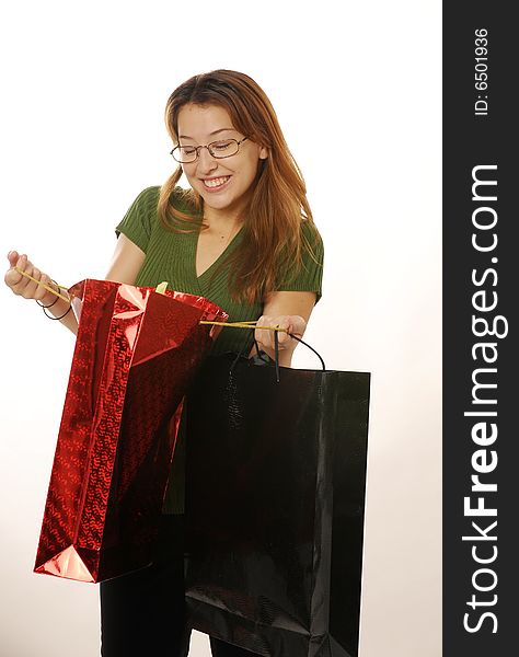 Beautiful young lady goes shopping for holiday. Beautiful young lady goes shopping for holiday