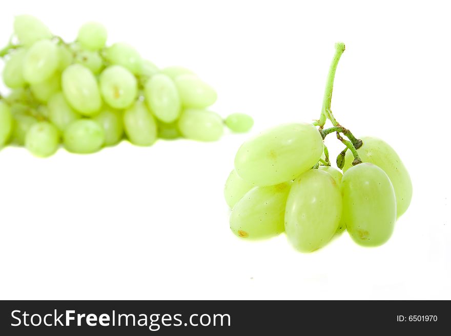 Green grapes isolated on white