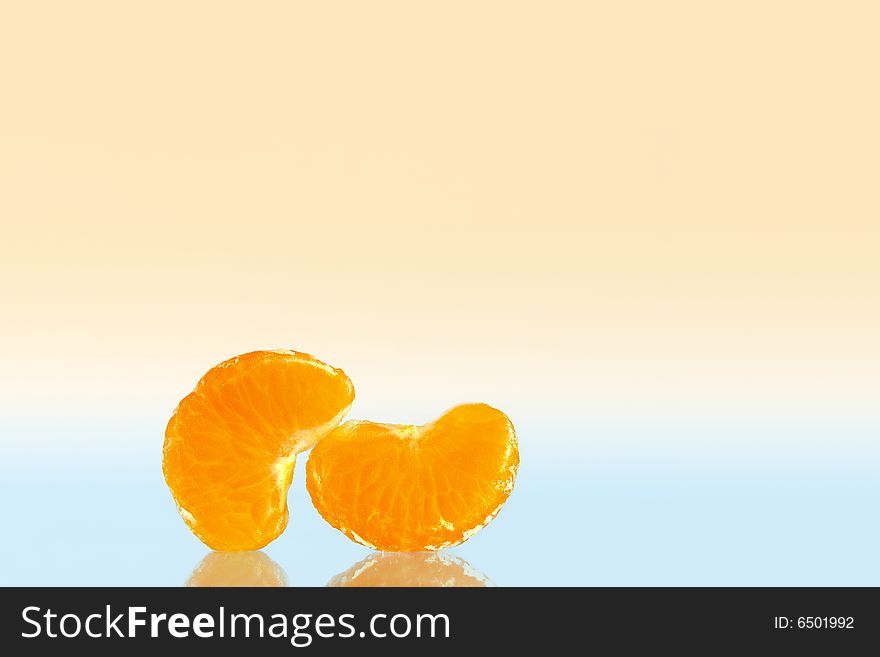 Two mandarine slices in people poses. Two mandarine slices in people poses