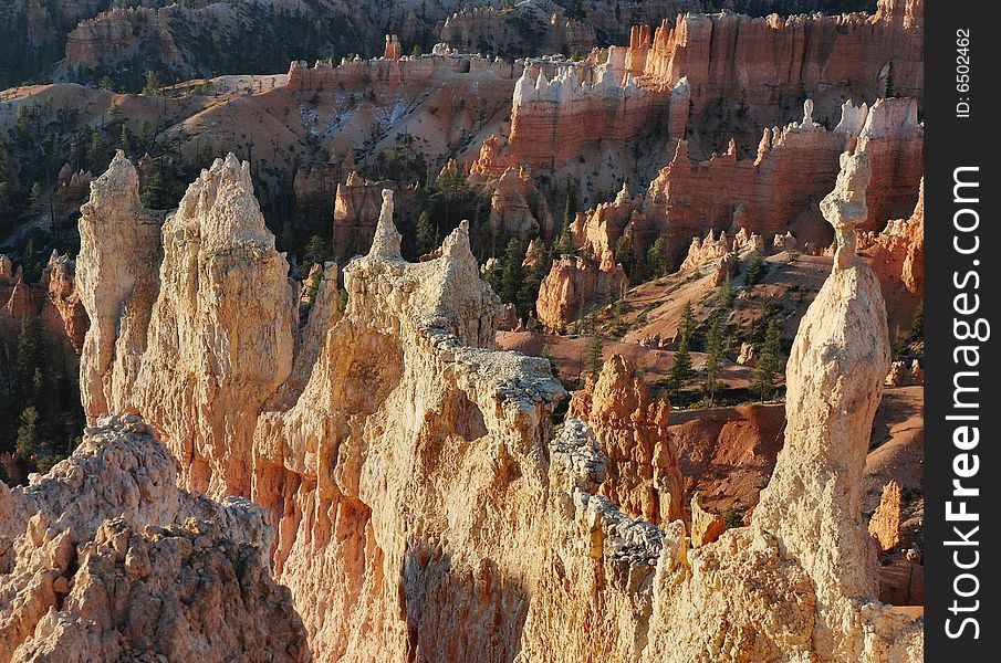 Image of Queen's Garden hoodoos shimmering at sunrise at Bryce Canyon National Park, Utah. Image of Queen's Garden hoodoos shimmering at sunrise at Bryce Canyon National Park, Utah.