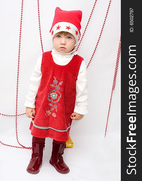 Happy infant with gifts in the decorated christmas box;