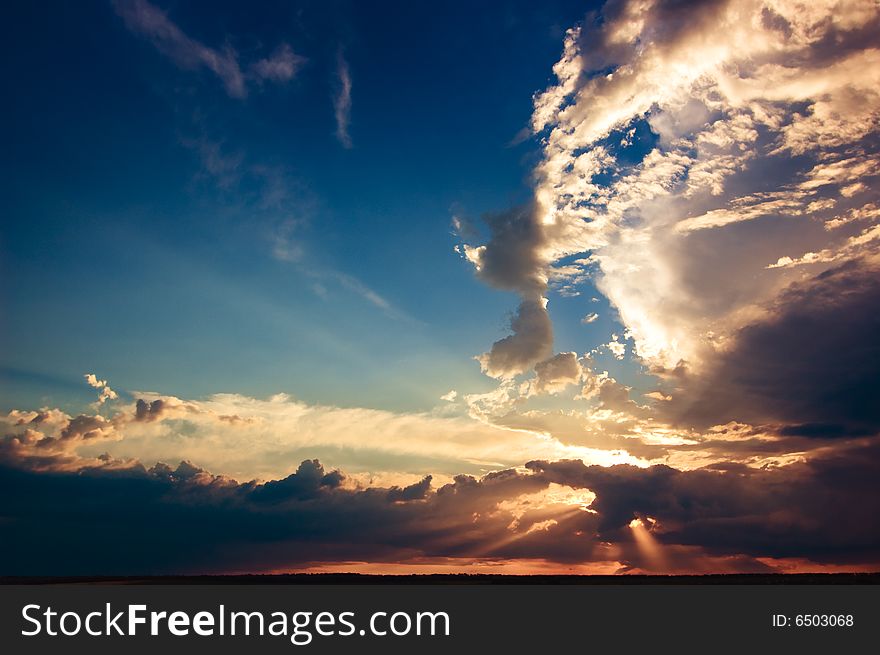 Dark sunset with tiny hazy clouds