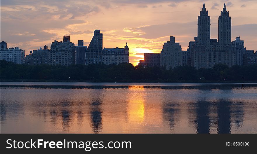 Manhattan sunset over the reservoir in central park