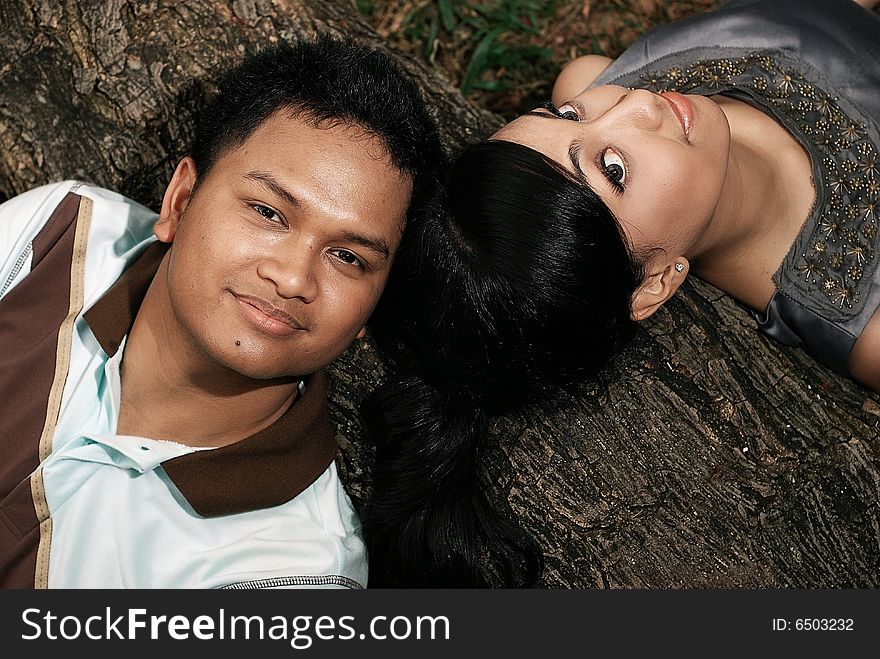 Happy Young Asian Couple Together having fun