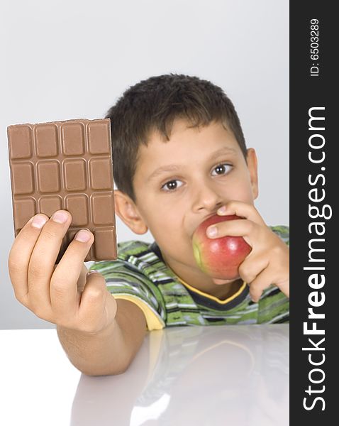 Boy holding an apple chocolate. Boy holding an apple chocolate