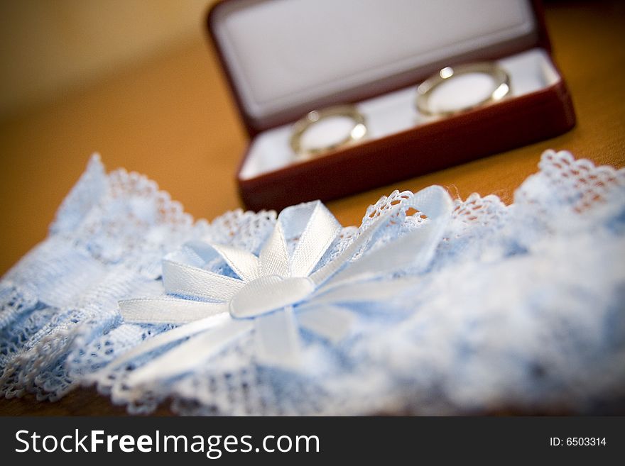 Red box with wedding rings and blue  garment. Red box with wedding rings and blue  garment