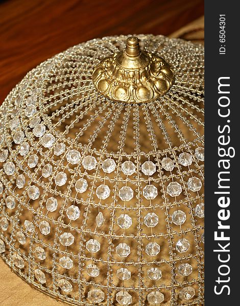 Detail shot of decorative crystal bonnet on table. Detail shot of decorative crystal bonnet on table