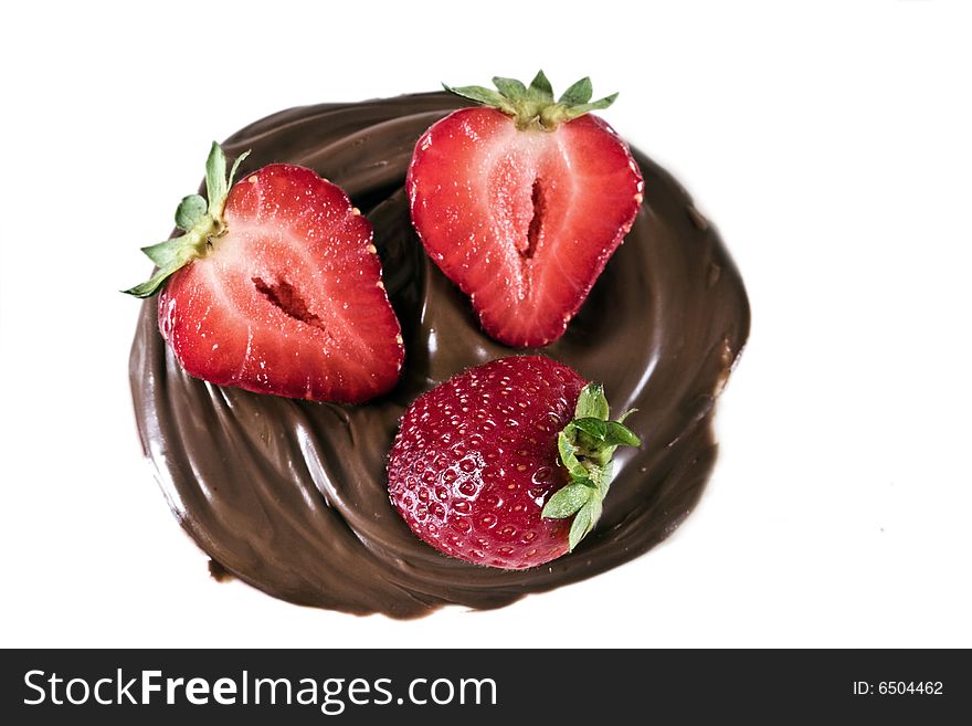 Strawberry in chocolate whirl on a white background