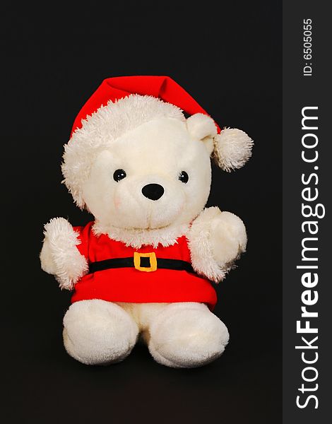 Santa teddy bear on a black background. Santa teddy bear on a black background