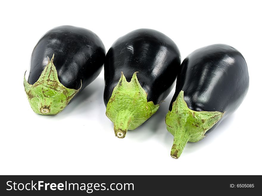 Isolated eggplant with stem over white background.