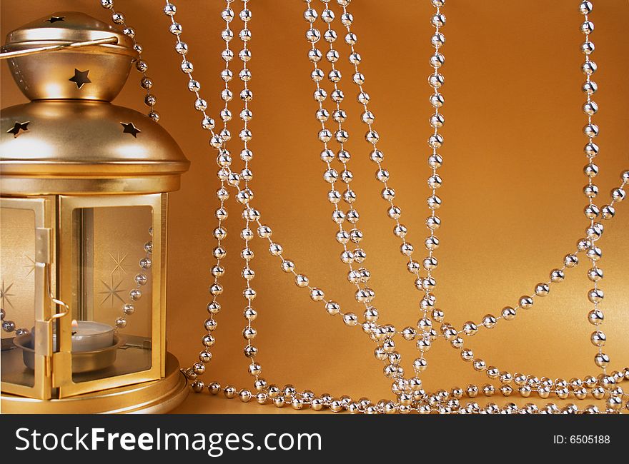 Golden Attributes of Christmas - lamp, decoration, beads, candle