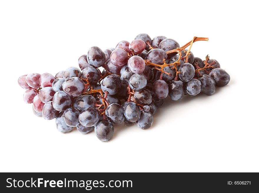 Isolated purple ripe grape berries on white