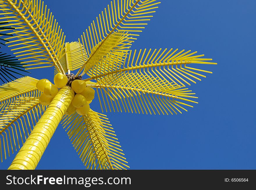 Yellow palms on beach with sky background. Yellow palms on beach with sky background