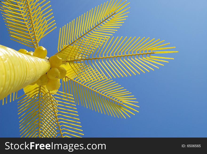 Yellow palms on beach with sky background. Yellow palms on beach with sky background