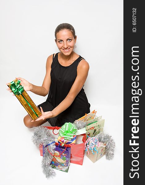 Woman holding onto a bunch of colorful shopping bags