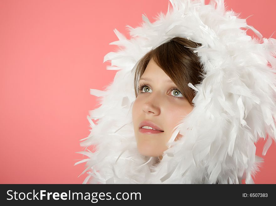 Portrait of the beautiful young girl in a boa
