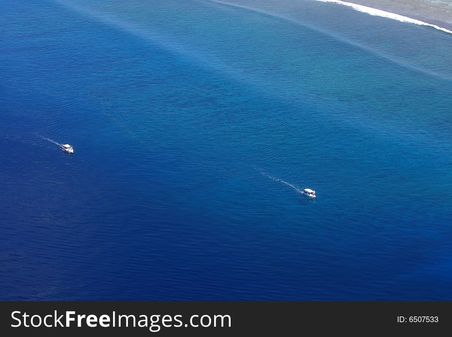 Aerial view of yachts in exotic ocean