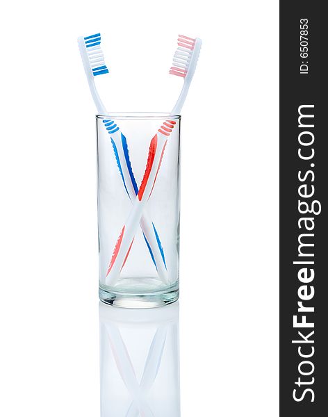 New toothbrush in glass, isolated