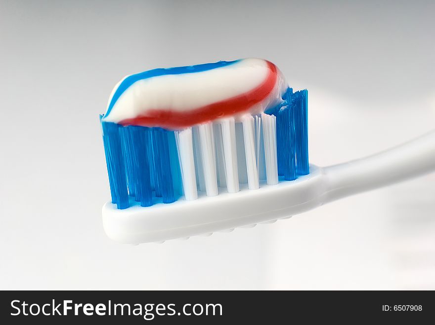 Toothbrush with toothpaste close-up