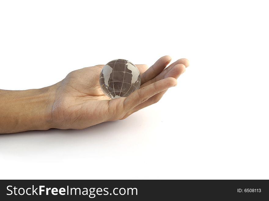 Stock image of a crystal globe in hand. Stock image of a crystal globe in hand